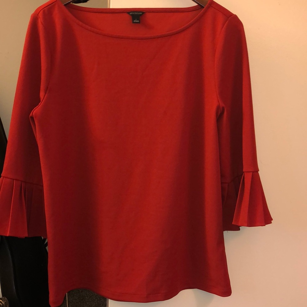 Ann Taylor blouse. Burnt orange color. Cute ruffles on arms.